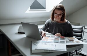 Tata Motors Share Price Trends: Analyzing with the Help of Demat Accounts Investor analyzing stock market share price charts on a laptop