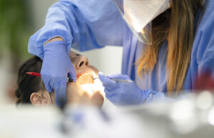 How To Find the Best Orthodontist for Your Braces Orthodontist examining a patient's braces during a checkup