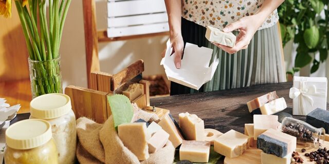 Woman packing handmade soap bars