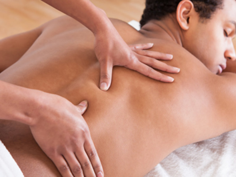 How do I massage my own upper back?