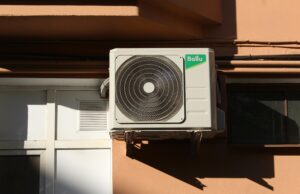 Comprehensive Insights into Heating and AC Systems HVAC technician inspecting a home heating and air conditioning unit