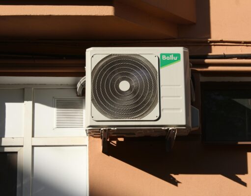 Comprehensive Insights into Heating and AC Systems HVAC technician inspecting a home heating and air conditioning unit