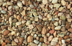 How to Choose the Right Gravel for Erosion Control in Your Yard Gravel path laid along a sloped yard to control erosion